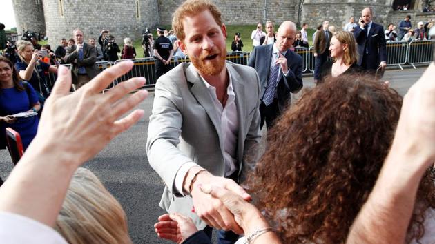Prince Harry greets well-wishers outside Windsor Castle where he spent the night before his ahead of his wedding. Harry and his best-man-to-be Prince William stayed the night at Dorchester Collection’s Coworth Park. (Damir Sagolj / REUTERS)