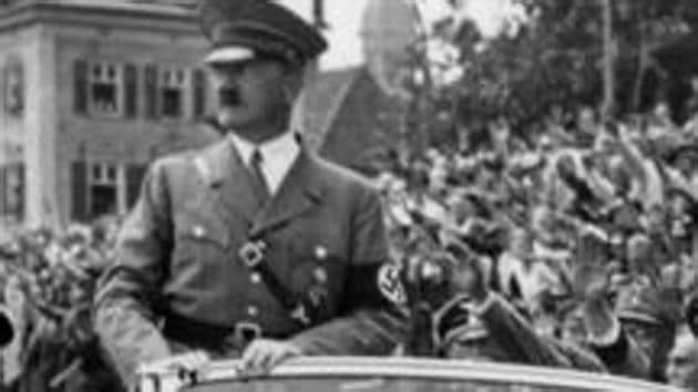 Undated taken from the year 1937 shows German Chancellor Adolf Hitler standing in a convertible Mercedes reviewing SA and SS troops and wellwishers somewhere in Germany. (AFP) Undated taken from the year 1937 shows German Chancellor Adolf Hitler standing in a convertible Mercedes reviewing SA and SS troops and wellwishers somewhere in Germany. (AFP)