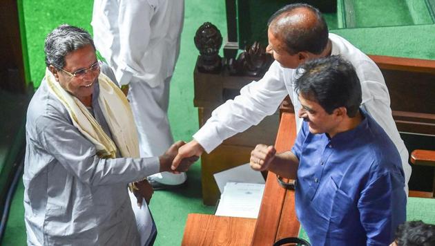 Former Chief Minister & Congress leader Siddaramaiah meets congress leaders after Chief Minister B S Yediyurappa announce his resignation before the floor test, at Vidhana Soudha, in Bengaluru, on Saturday. (PTI Photo) Former Chief Minister & Congress leader Siddaramaiah meets congress leaders after Chief Minister B S Yediyurappa announce his resignation before the floor test, at Vidhana Soudha, in Bengaluru, on Saturday. (PTI Photo)
