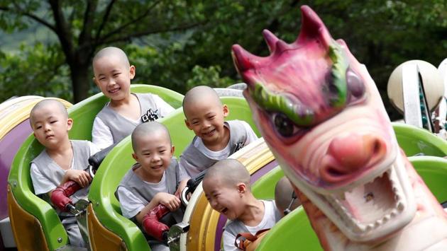 Boys, who are experiencing the lives of Buddhist monks by staying in a temple for two weeks as novice monks, enjoy a ride at the Everland amusement park in Yongin, South Korea. (Kim Hong-ji / REUTERS) Boys, who are experiencing the lives of Buddhist monks by staying in a temple for two weeks as novice monks, enjoy a ride at the Everland amusement park in Yongin, South Korea. (Kim Hong-ji / REUTERS)
