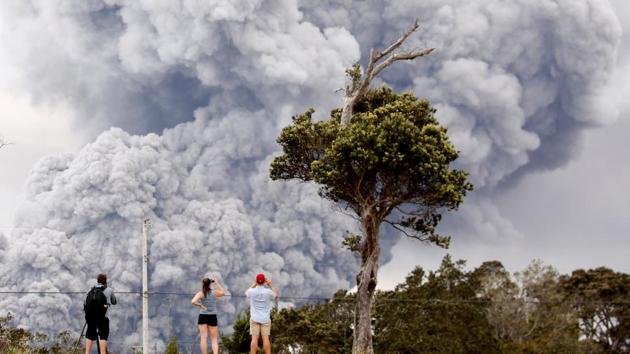 People watch as ash erupts from the Halemaumau crater near the community of Volcano during ongoing eruptions of the Kilauea Volcano in Hawaii. (Terray Sylvester / REUTERS) People watch as ash erupts from the Halemaumau crater near the community of Volcano during ongoing eruptions of the Kilauea Volcano in Hawaii. (Terray Sylvester / REUTERS)