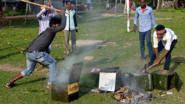 Unidentified persons damage ballot boxes after snatching them from a polling booth during Panchayat polls at Deotala in West Bengal’s Malda district, on May 14, 2018. (PTI) Unidentified persons damage ballot boxes after snatching them from a polling booth during Panchayat polls at Deotala in West Bengal’s Malda district, on May 14, 2018. (PTI)