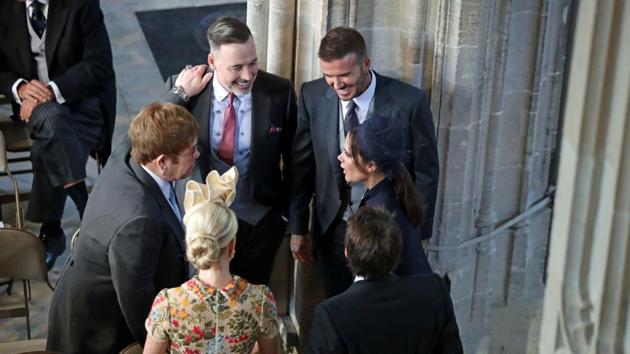 David and Victoria Beckham talk with Sir Elton John and David Furnish as they arrive in St George's Chapel. (Danny Lawson/Pool via REUTERS) David and Victoria Beckham talk with Sir Elton John and David Furnish as they arrive in St George's Chapel. (Danny Lawson/Pool via REUTERS)