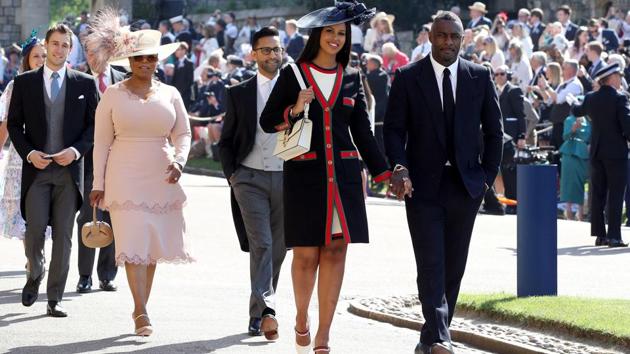 Idris Elba and Sabrina Dhowre followed by Oprah Winfrey (4th right) arrive at St George's Chapel at Windsor Castle. (Chris Radburn / Pool via REUTERS) Idris Elba and Sabrina Dhowre followed by Oprah Winfrey (4th right) arrive at St George's Chapel at Windsor Castle. (Chris Radburn / Pool via REUTERS)