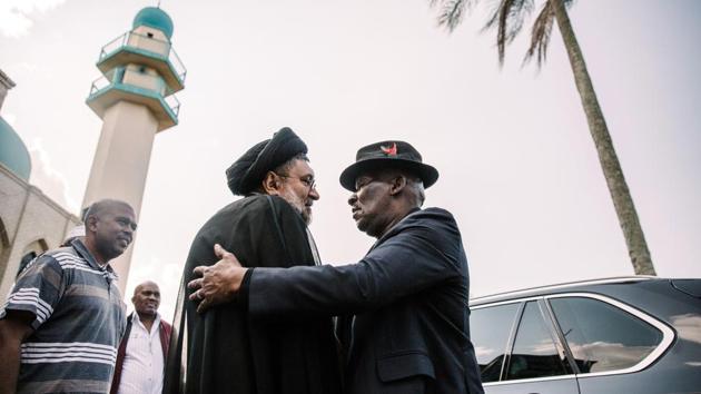 South African Police Minister Bheki Cele (R) is greeted by Moulana Sayed Afthab Haider, the national co-ordinator of the Ahlul Bait Foundation of South Africa, an umbrella body that oversees Shiite mosques, as he visits the Shiite Muslim Imam Hussain Mosque in Verulam on the outskirts of Durban, after an attack which left one person dead and two injured. (Rajesh Jantilal / AFP) South African Police Minister Bheki Cele (R) is greeted by Moulana Sayed Afthab Haider, the national co-ordinator of the Ahlul Bait Foundation of South Africa, an umbrella body that oversees Shiite mosques, as he visits the Shiite Muslim Imam Hussain Mosque in Verulam on the outskirts of Durban, after an attack which left one person dead and two injured. (Rajesh Jantilal / AFP)