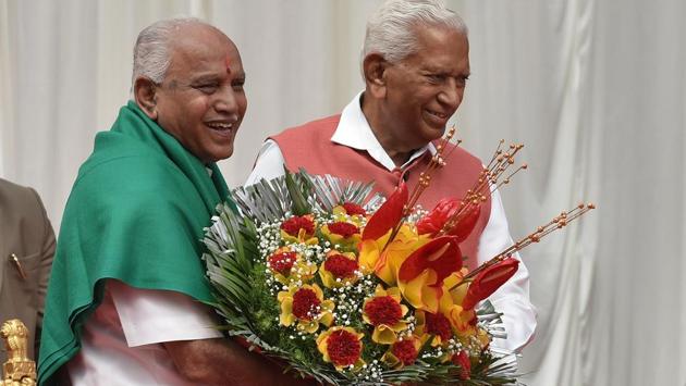 Governor of Karnataka Vajubhai Rudabhai Vala felicitates Bhartiya Janta Party leader B S Yeddyurappa after his oath taking ceremony as the 23rd chief minister of Karnataka at Raj Bhawan in Bengaluru, Karnataka, on May 17, 2018. (Arijit Sen / HT Photo) Governor of Karnataka Vajubhai Rudabhai Vala felicitates Bhartiya Janta Party leader B S Yeddyurappa after his oath taking ceremony as the 23rd chief minister of Karnataka at Raj Bhawan in Bengaluru, Karnataka, on May 17, 2018. (Arijit Sen / HT Photo)