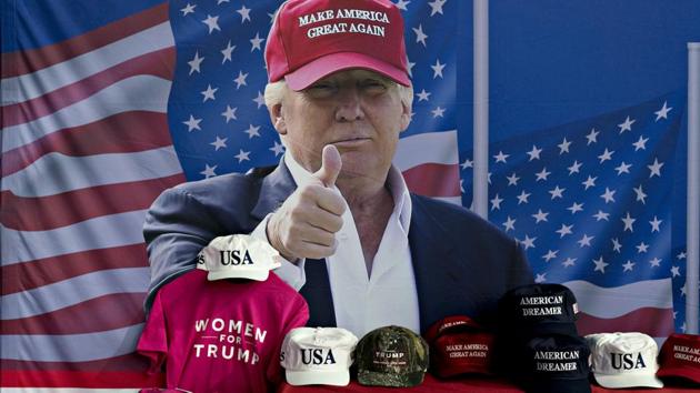 A banner featuring an image of US President Donald Trump is seen near a table with official campaign merchandise during a rally in Washington, Michigan, US, on Saturday, April 28, 2018. (Bloomberg) A banner featuring an image of US President Donald Trump is seen near a table with official campaign merchandise during a rally in Washington, Michigan, US, on Saturday, April 28, 2018. (Bloomberg)