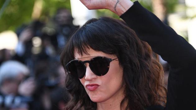 Italian actor Asia Argento raises her fist as she arrives on May 19, 2018 for the closing ceremony.(AFP)