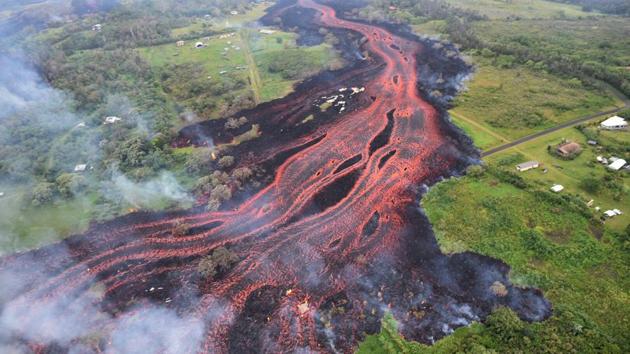 Lava flows from fissures near Pahoa, Hawaii. The volcano began erupting more than two weeks ago and has since burned down dozens of homes, forced people to flee and shot up plumes of steam from its summit that led officials to distribute face masks to protect against ash particles. (US Geological Survey / AP) Lava flows from fissures near Pahoa, Hawaii. The volcano began erupting more than two weeks ago and has since burned down dozens of homes, forced people to flee and shot up plumes of steam from its summit that led officials to distribute face masks to protect against ash particles. (US Geological Survey / AP)