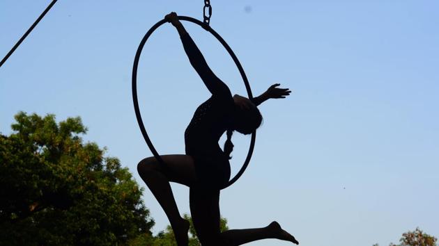 Girl performs aerial yoga using a hoop during the closing ceremony of summer camp 2018 at Modern English medium school, Shivajinagar, on Sunday. Participants have been practising for over a month for the closing event. (Shankar Narayan/HT PHOTO) Girl performs aerial yoga using a hoop during the closing ceremony of summer camp 2018 at Modern English medium school, Shivajinagar, on Sunday. Participants have been practising for over a month for the closing event. (Shankar Narayan/HT PHOTO)