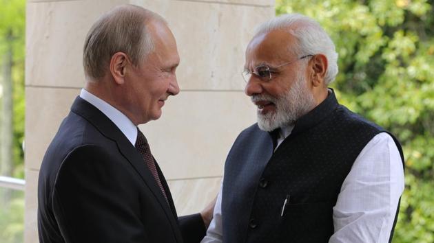 Russian President Vladimir Putin greets Prime Minister Narendra Modi during their meeting in the Bocharov Ruchei residence in the Black Sea resort of Sochi in Russia on May 21.(AP Photo)