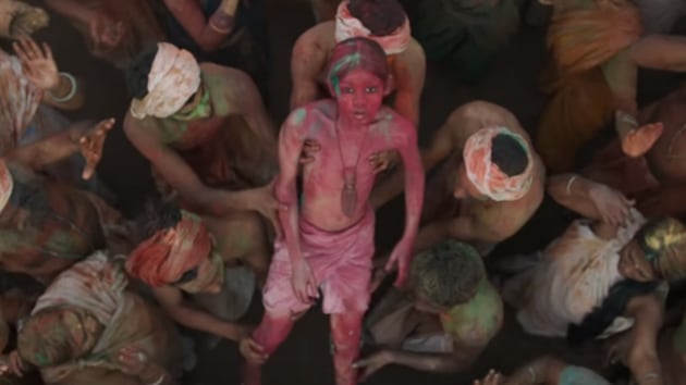 The man-cub plays Holi in a still from Mowgli.(YouTube)