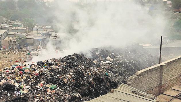 Residents have been raising the issue of garbage burning in Wagholi area for the past five years. (HT Photo) Residents have been raising the issue of garbage burning in Wagholi area for the past five years. (HT Photo)