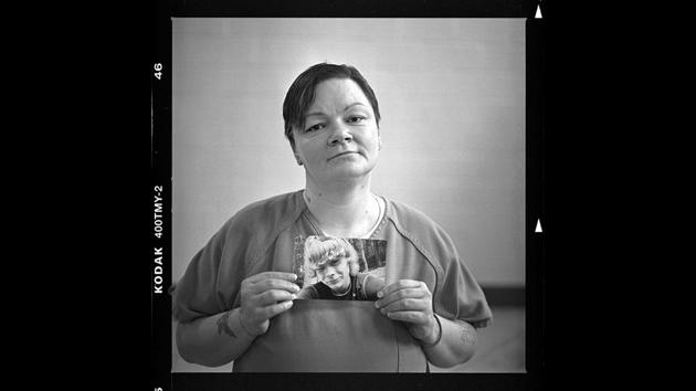 Sammons, 41, holds a picture of her son, Micah, 20, who was murdered on March 23. On the inside, they bond, while relationships with those on the outside crumble. Children wind up in state care or are turned over to relatives. Grandparents become parents, yet again. And with each day that passes, the women dream of mending broken ties and changing their ways. (David Goldman / AP)
