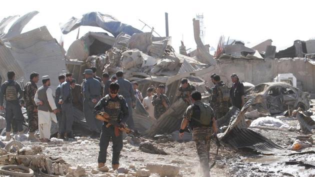 Afghan security forces inspect the site of a blast in Kandahar province, Afghanistan. (Reuters Photo) Afghan security forces inspect the site of a blast in Kandahar province, Afghanistan. (Reuters Photo)