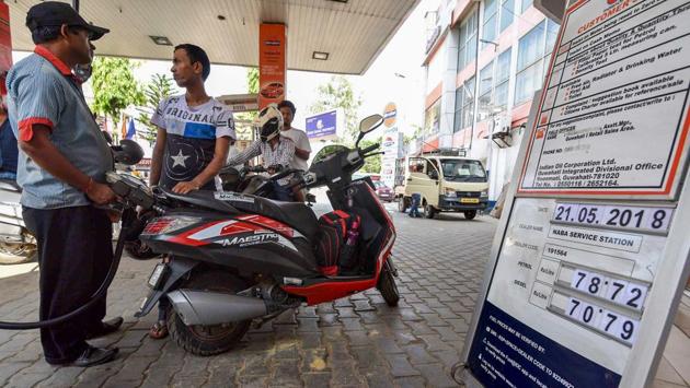 A fuel station displaying the current fuel prices in Guwahati on Monday. Petrol and diesel prices were increased in the range of 33-34 paise per litre and 25-27 paise per litre across Delhi, Kolkata, Mumbai and Chennai. (PTI Photo)