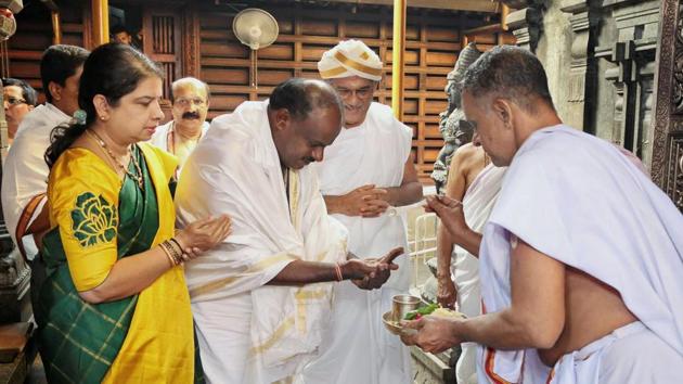 JD(S) leader and Karnataka chief minister-designate H D Kumaraswamy visits Manjunatha Swamy temple, ahead of his swearing-in ceremony, at Kshetra Dharmasthala in Karnataka. With a day to go for his government’s inauguration demands for portfolios grew with leaders of various parties and outfits posturing ahead of the swearing in. A group of Muslim organisations demanded today that a minority leader be made the deputy chief minister of the state. (PTI) JD(S) leader and Karnataka chief minister-designate H D Kumaraswamy visits Manjunatha Swamy temple, ahead of his swearing-in ceremony, at Kshetra Dharmasthala in Karnataka. With a day to go for his government’s inauguration demands for portfolios grew with leaders of various parties and outfits posturing ahead of the swearing in. A group of Muslim organisations demanded today that a minority leader be made the deputy chief minister of the state. (PTI)