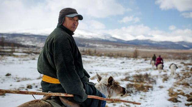 Local doctor Davaajav Nyamaa rides a reindeer to visit nomads in the forest. The hunting tradition has always defined a man in the Taiga, said Chuluu’s neighbour Naran-Erdene Bayar, “It feels like we’ve lost something because we can’t move to whichever area we like in this land, which has been handed down to us from our ancestors.” (Thomas Peter / REUTERS) Local doctor Davaajav Nyamaa rides a reindeer to visit nomads in the forest. The hunting tradition has always defined a man in the Taiga, said Chuluu’s neighbour Naran-Erdene Bayar, “It feels like we’ve lost something because we can’t move to whichever area we like in this land, which has been handed down to us from our ancestors.” (Thomas Peter / REUTERS)