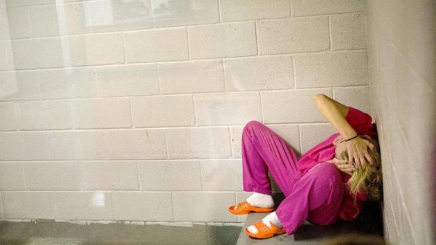 Jessica Morgan, high on methamphetamines and the opioid pain medication Opana, sits in a holding cell after being booked for drug possession at the Tennessee‘s Campbell County Jail. More than a decade ago, there were rarely more than 10 women inmates here compared to around 60 routinely now –an example of how the opioid epidemic is fuelling the fastest-growing correctional population in America: Women. (David Goldman / AP)
