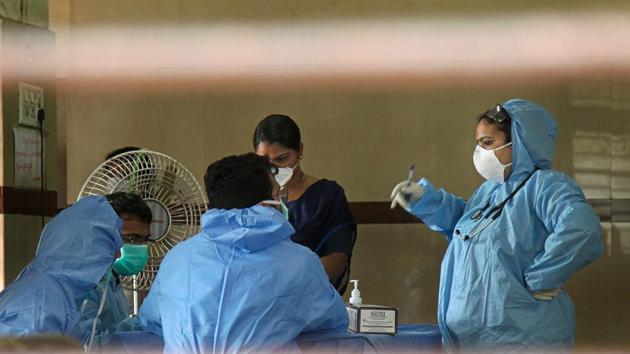 Hospital staff wears safety masks as a precautionary measure at the Kozhikode Medical College after the 'Nipah' virus outbreak, in Kozhikode. (PTI Photo) Hospital staff wears safety masks as a precautionary measure at the Kozhikode Medical College after the 'Nipah' virus outbreak, in Kozhikode. (PTI Photo)