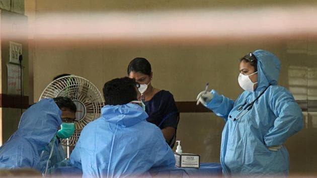 Hospital staff wears safety masks as a precautionary measure at the Kozhikode Medical College where patients infected with the Nipah virus are being treated.(PTI Photo)