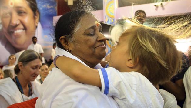 Known among her followers as "Amma," which means "mother" in several Indian languages, Amritanandamayi has devotees in India and the rest of the world. She is also popularly known as the Hugging Saint. (AP) Known among her followers as "Amma," which means "mother" in several Indian languages, Amritanandamayi has devotees in India and the rest of the world. She is also popularly known as the Hugging Saint. (AP)