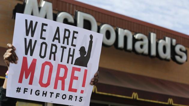 McDonald's workers and supporters rally outside a McDonald's in Chicago.(AP File Photo) McDonald's workers and supporters rally outside a McDonald's in Chicago.(AP File Photo)