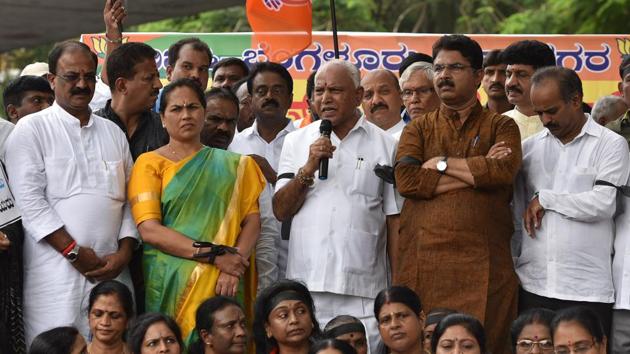 Karnataka BJP chief BS Yeddyurappa (centre) along with BJP State General Secretary Shobha Karandlaje and other party supporters protest against the coalition government by Janta Dal (secular) and Congress, ahead of the swearing-in ceremony of the 24th Chief Minister of Karnataka, H. D. Kumaraswamy at Bengaluru’s Maurya Circle. (Arijit Sen / HT Photo) Karnataka BJP chief BS Yeddyurappa (centre) along with BJP State General Secretary Shobha Karandlaje and other party supporters protest against the coalition government by Janta Dal (secular) and Congress, ahead of the swearing-in ceremony of the 24th Chief Minister of Karnataka, H. D. Kumaraswamy at Bengaluru’s Maurya Circle. (Arijit Sen / HT Photo)