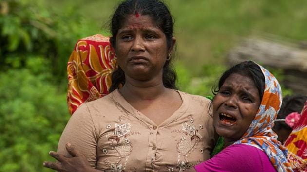 In this file photo taken on September 27, 2017, Hindu women cry near the dead bodies of their family members in Ye Baw Kyaw village, Maungdaw in Myanmar's northern Rakhine state.(AFP File)