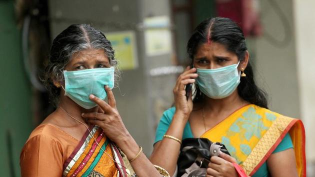 The Kerala government has announced monetary aid of Rs 20 lakh for the family of Lini Puthussery, a 31-year-old nurse who died after attending to those infected with the deadly Nipah virus in the state. Seen here are her relatives wearing masks. Amid the outbreak of the virus, the state government on Wednesday asked travellers to avoid visiting four northern districts of the state -- Kozhikode, Malappuram, Wayanad and Kannur. (PTI) The Kerala government has announced monetary aid of Rs 20 lakh for the family of Lini Puthussery, a 31-year-old nurse who died after attending to those infected with the deadly Nipah virus in the state. Seen here are her relatives wearing masks. Amid the outbreak of the virus, the state government on Wednesday asked travellers to avoid visiting four northern districts of the state -- Kozhikode, Malappuram, Wayanad and Kannur. (PTI)