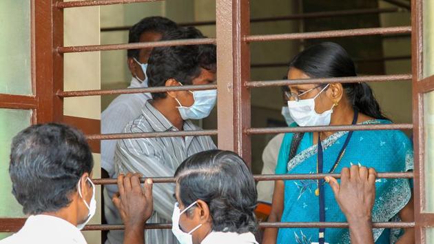 Doctors and patients wear safety masks as a precautionary measure after the 'Nipah' virus outbreak, at a Medical college, in Kozhikode.(PTI Photo)