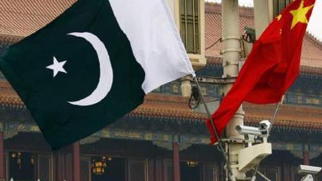 A Pakistan national flag flies alongside a Chinese national flag.(REUTERS File Photo)