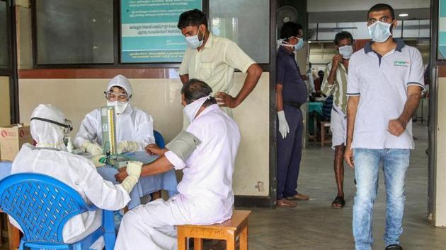 Doctors and patients wear safety masks as a precautionary measure after the 'Nipah' virus outbreak in Kozhikode.(PTI)