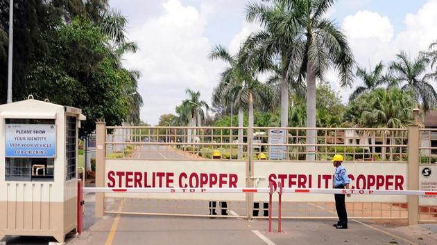 A private security guard stands in front of the main gate of Sterlite Industries Ltd's copper plant, a unit of London-based Vedanta Resources, in Tuticorin, on March 24, 2013.(REUTERS)