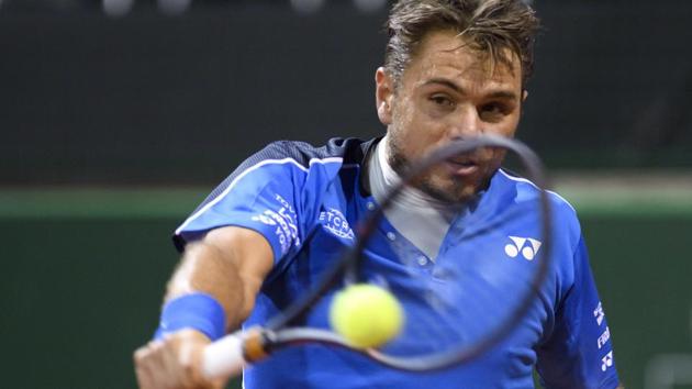 Stanislas Wawrinka returns a ball to Jared Donaldson of the United States during their second round match at the Geneva Open on Wednesday, May 23, 2018.(AP)