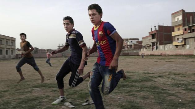 There is perhaps no place in Egypt that shows more passion for the English Premier League and the Champions League than Nagrig. Many of the village’s teenagers play barefooted at the pitch in the youth center where Salah is known to have played the game as a young boy -- strewn with litter but still accessible through a collapsed part of its outer wall. (Nariman El-Mofty / AP)