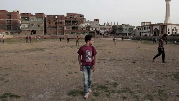 Boys play at the sports and youth center in Nagrig. “Salah is no longer just a talented and skilled football player. He is a symbol of efficiency, thoroughness, respect, learning, morals and moderate religion,” wrote Imad Hussein, editor of the independent Al-Shorouk daily. “He presents a glowing picture of Egyptians, Arabs and Muslims... that most of us are incapable of offering.” (Nariman El-Mofty/ AP)