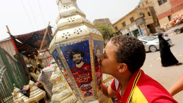 Salah’s impact in Egypt goes way beyond the money he has poured into his village. This year, his image is on lanterns traditionally given to children or used as ornaments during Ramzan. Traders have given his name to a kind of date and his appearance in a short anti-drugs film has sent the number of calls addicts made to help lines through the roof. (Amr Abdallah Dalsh / REUTERS)