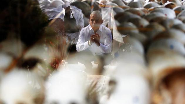 A man prays at the Choeung Ek memorial during the annual ‘Day of Anger’ where people gathered to remember those who perished during the communist Khmer Rouge regime, outskirts of Phnom Penh, Cambodia. (Samrang Pring / REUTERS)