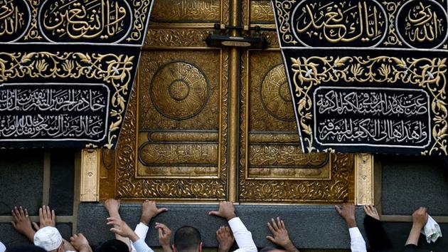 Muslims touch the Kaaba at the Grand Mosque during the holy fasting month of Ramadan in Mecca, Saudi Arabia. (Faisal Al Naseer / REUTERS)