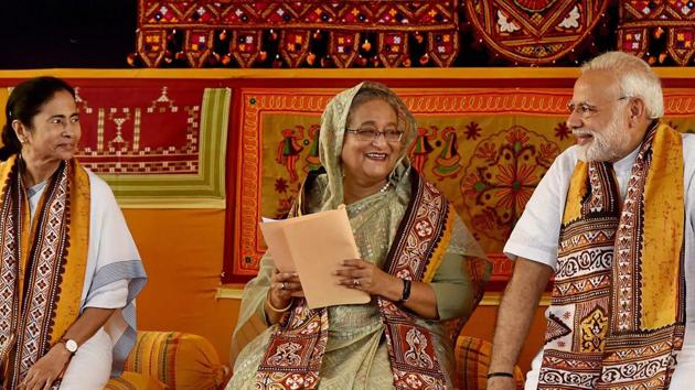 Prime Minister Narendra Modi with his Bangladeshi counterpart Sheikh Hasina and West Bengal chief minister Mamata Banerjee, during the annual convocation of Visva Bharati University, in Birbhum on Friday. (PTI Photo) Prime Minister Narendra Modi with his Bangladeshi counterpart Sheikh Hasina and West Bengal chief minister Mamata Banerjee, during the annual convocation of Visva Bharati University, in Birbhum on Friday. (PTI Photo)