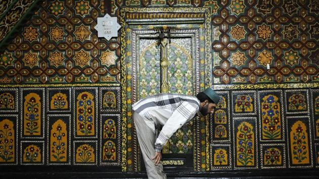A man offers prayers during the holy month of Ramzan inside a mosque adjacent to the shrine of Shah-e-Hamdan in Srinagar, Jammu and Kashmir on May 24, 2018. (Waseem Andrabi / HT Photo)