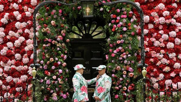 Doormen dressed in floral pattern suits stand on duty outside of Annabel's private members club, adorned with thousands of flowers, timed to coincide with the RHS Chelsea Flower Show, in London, England. (Toby Melville / REUTERS)