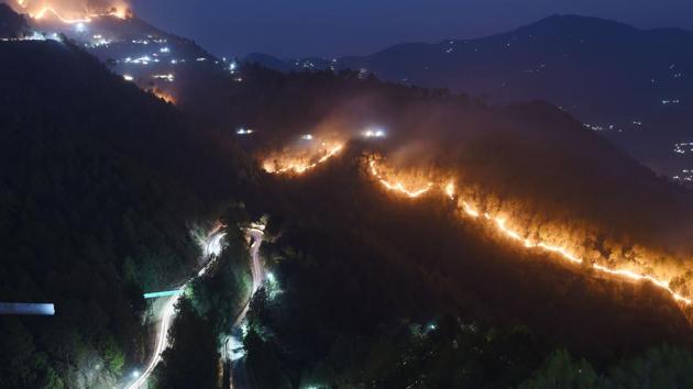 Wildfires burn in the hills around New Tehri at Bourari in Uttarakhand. (Prakash Singh / AFP) Wildfires burn in the hills around New Tehri at Bourari in Uttarakhand. (Prakash Singh / AFP)