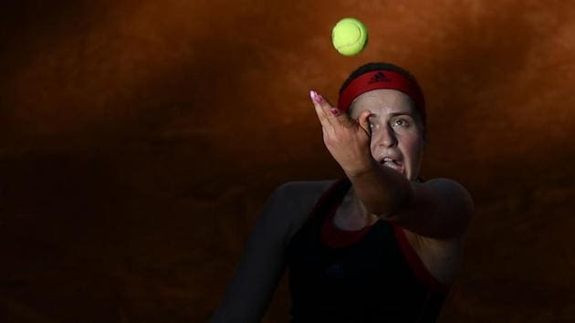 Latvia's Jelena Ostapenko serves against Russia's Maria Sharapova during their quarter final match at Rome's WTA Tennis Open tournament at the Foro Italico in Rome, Italy. (Filippo Monteforte / AFP)