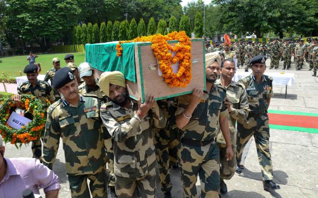 Border Security Force officers and jawans carry the coffin of Sitaram Upadhyay, who was killed in ceasefire violation by Pakistani army along the International Border, in Jammu. (PTI File Photo) Border Security Force officers and jawans carry the coffin of Sitaram Upadhyay, who was killed in ceasefire violation by Pakistani army along the International Border, in Jammu. (PTI File Photo)