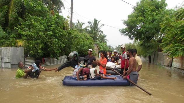Sri Lankans make their way to an inflatable raft to move to safer ground on the outskirts of Puttalam, Sri Lanka, Friday, May 25, 2018. (AP) Sri Lankans make their way to an inflatable raft to move to safer ground on the outskirts of Puttalam, Sri Lanka, Friday, May 25, 2018. (AP)