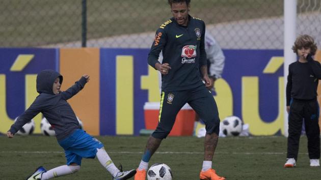 Brazil's Neymar plays with his son Davi Lucca, left, and one of his son's friends after a practice session of the Brazilian national football team ahead the World Cup in Russia, at the Granja Comary training center In Teresopolis (AP) Brazil's Neymar plays with his son Davi Lucca, left, and one of his son's friends after a practice session of the Brazilian national football team ahead the World Cup in Russia, at the Granja Comary training center In Teresopolis (AP)