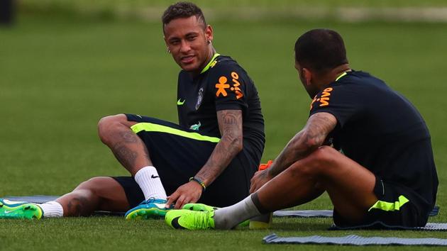 While Brazil football team star Neymar (L) has recovered from a foot fracture in time, his teammate Dani Alves will not recover from a knee injury he suffered and won’t play in the 2018 FIFA World Cup in Russia.(Getty Images)