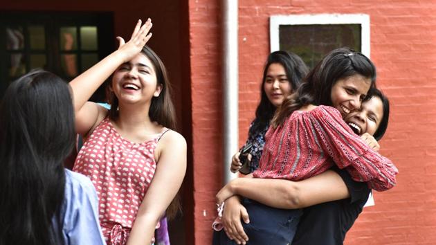 Students react after the CBSE Class 12 results at St Thomas' School, Mandir Marg, on Saturday.(Sanchit Khanna/HT Photo)